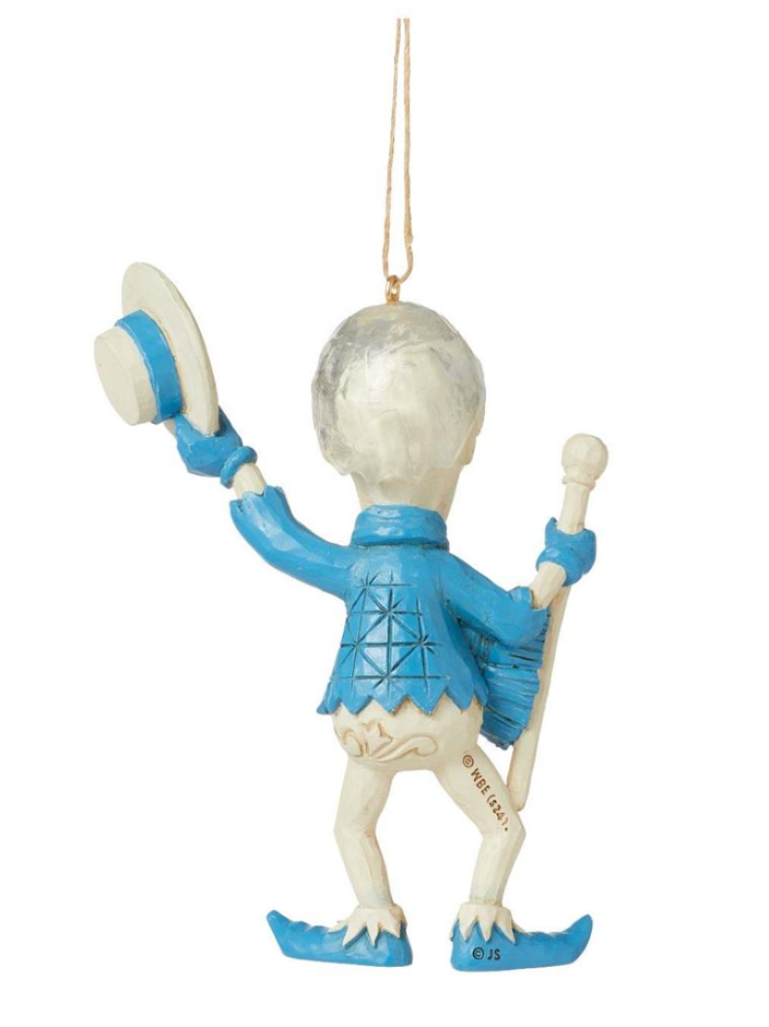 Decorative ornament of a skeleton in a blue outfit with a hat and staff on a white background