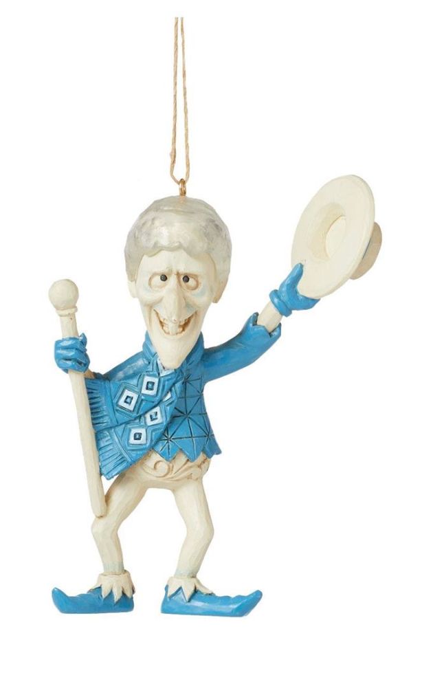 Decorative figurine of a person in blue attire with a hat and staff on a white background