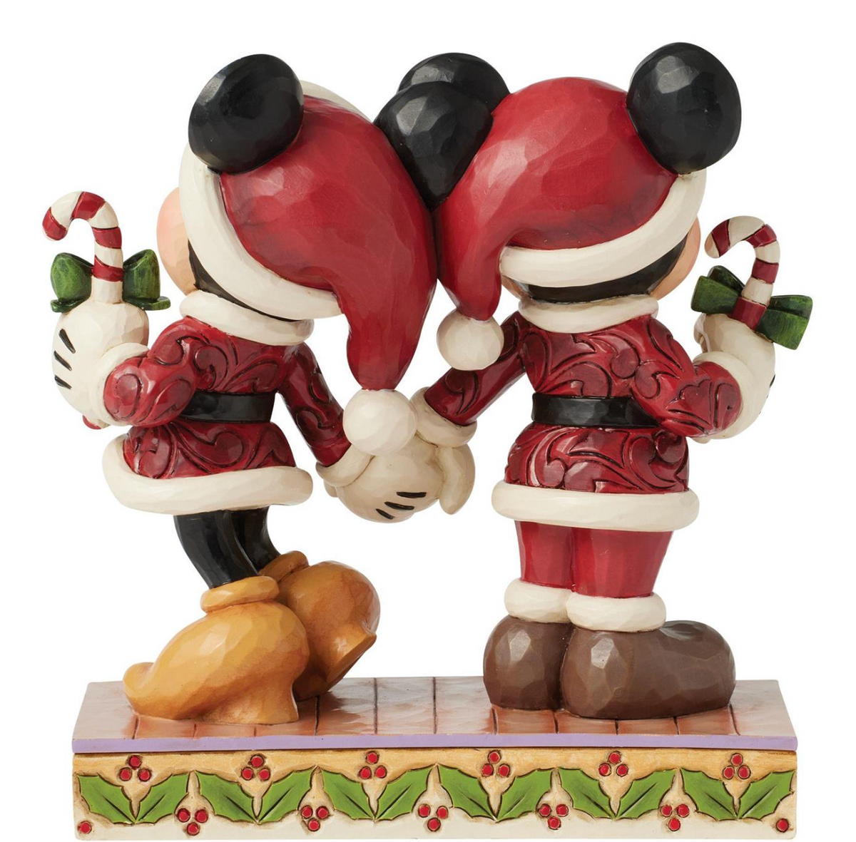 Disney's Mickey and Minnie Mouse figures in Santa outfits with candy canes on a decorative base. Artist Jim Shore