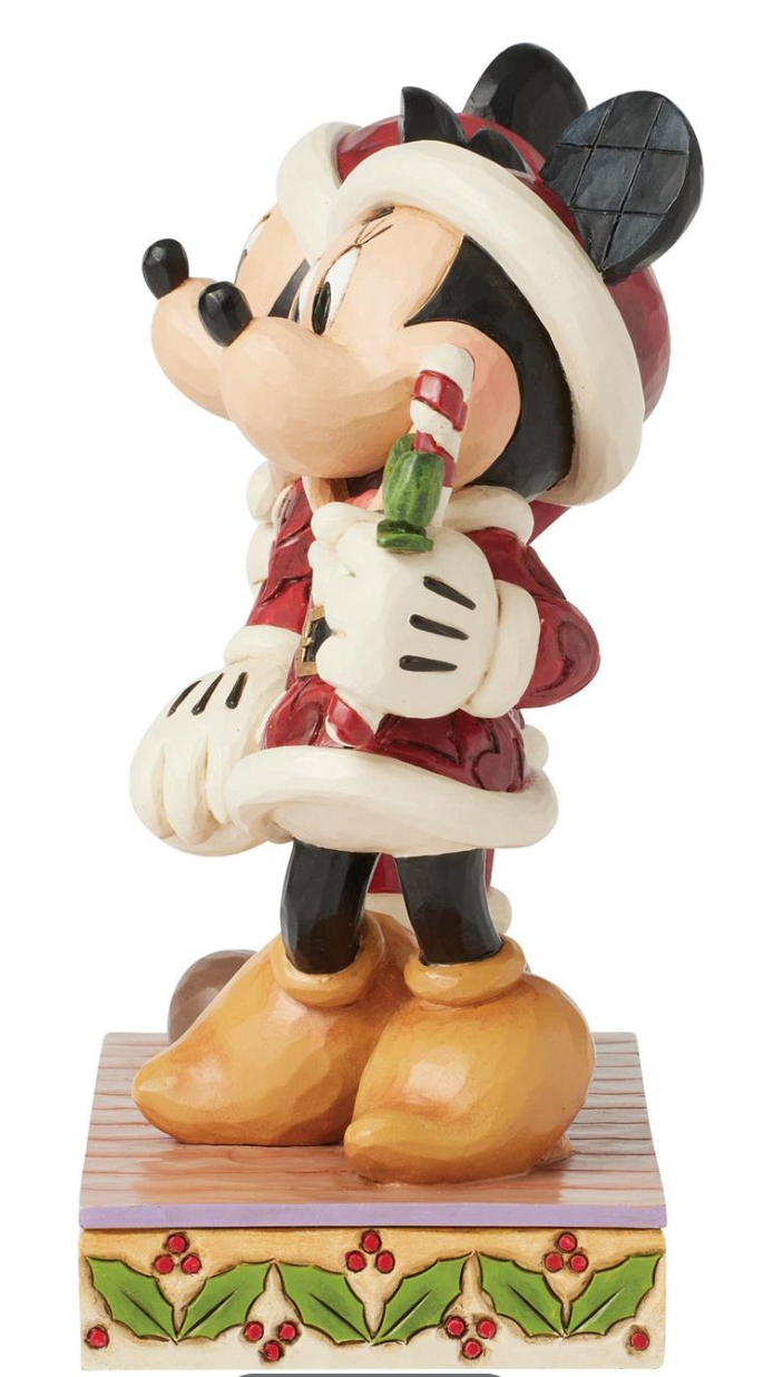 Disney's Mickey and Minnie Mouse figurine in a festive outfit holding a candy cane on a white background.. Artist Jim Shore