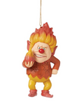 Decorative figurine of a character with flame-like hair and a red nose, holding a flower, on a white background.