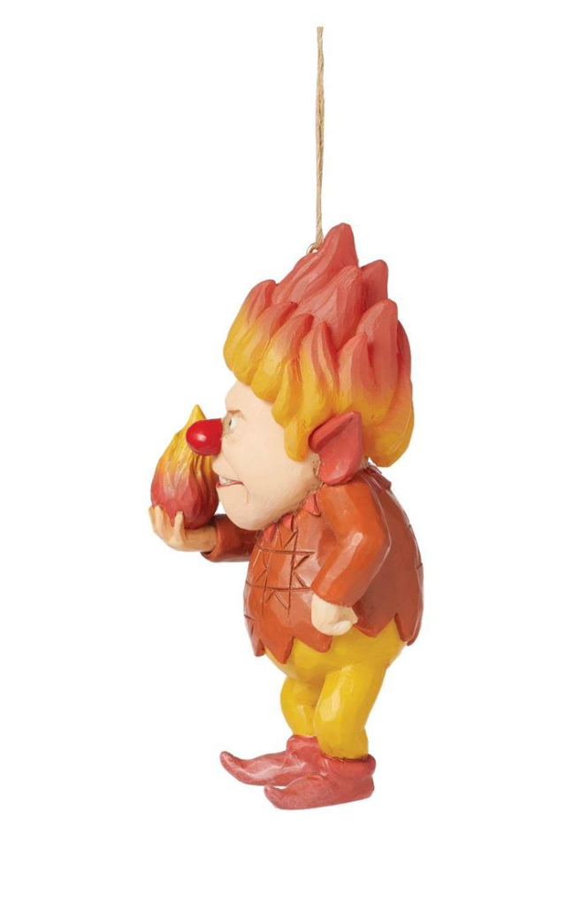 Decorative figurine of a character with flame-like hair on a white background
