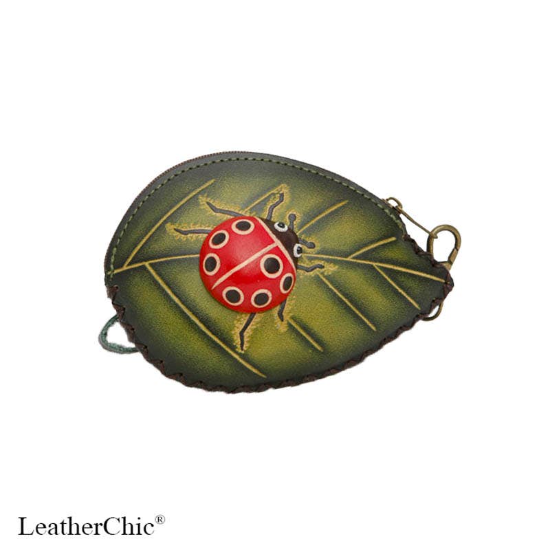 A small leaf-shaped leather pouch with a ladybug applique on a green leaf design, shown on a white background with the LeatherChic brand name at the bottom.