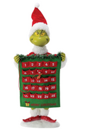 Grinch holding a Christmas advent calendar with a white background