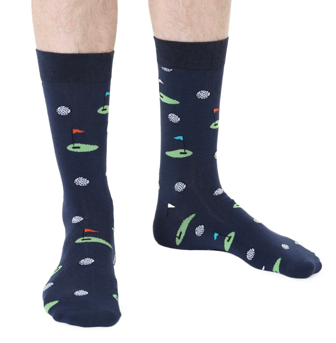 Navy socks with golf course pattern worn by a person on a white background