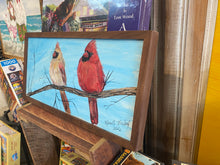 Load image into Gallery viewer, Framed painting of two cardinals on a branch with a blue sky background.
