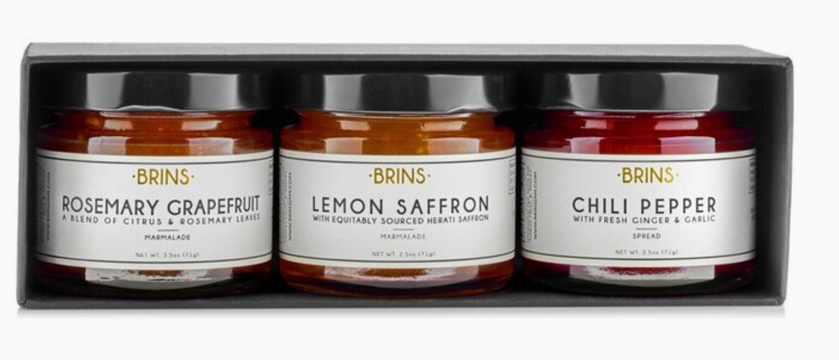 Three jars of Brins spreads in a box, labeled 'Rosemary Grapefruit', 'Lemon Saffron', and 'Chili Pepper'.