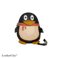 A penguin-shaped leather crossbody bag with a black body, cream belly, yellow beak and feet, and a red-and-cream striped scarf, shown on a white background with a LeatherChic watermark.