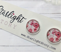 Floral earrings on a 'Starlight Story' branded card with a white background