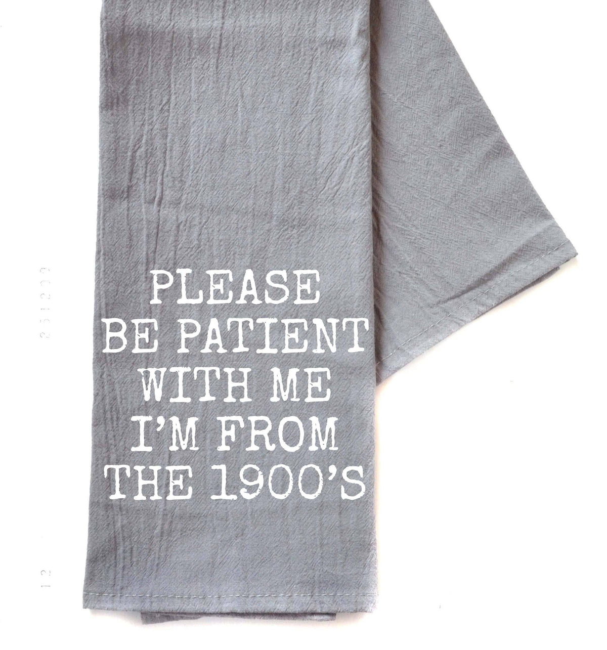 Gray towel with white text 'MY DOG AND I TALK SHIT ABOUT YOU' on a white background