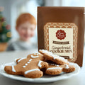 Gingerbread cookies on a plate with a box of Ann Clark Gingerbread Cookie Mix in the background.
