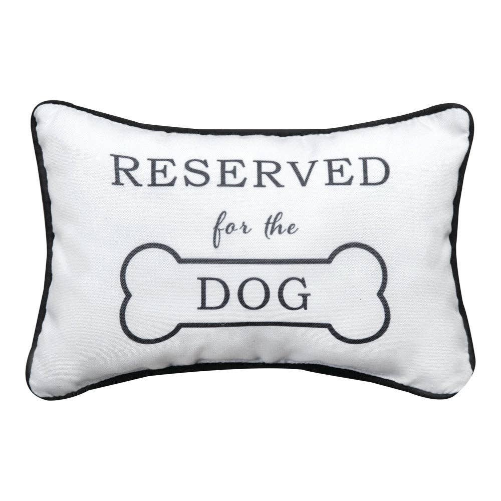 Decorative pillow with 'Reserved for the Dog' text on a white background