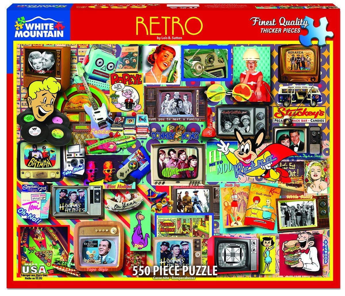 Retro-themed puzzle packaging with colorful graphics and 'White Mountain Puzzles' branding.