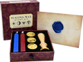 Sealing wax stamp kit with candles, stamp, and a sealed envelope on a white background