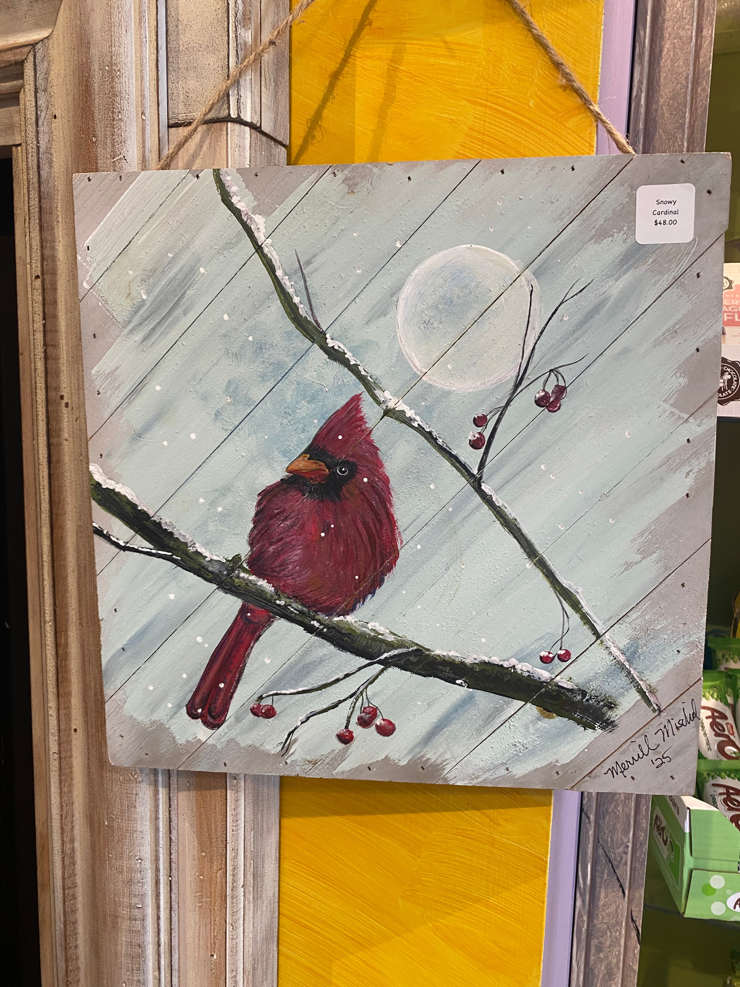 Painting of a cardinal bird on a branch with berries and a full moon in the background.