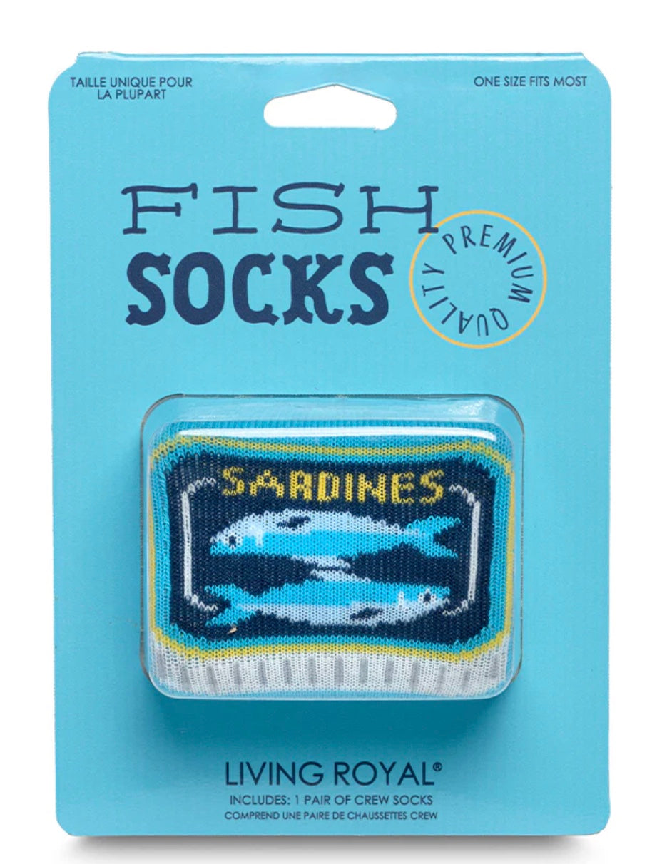 Packaged fish-themed socks with 'Sardines' design on a blue background, brand 'Living Royal' visible.