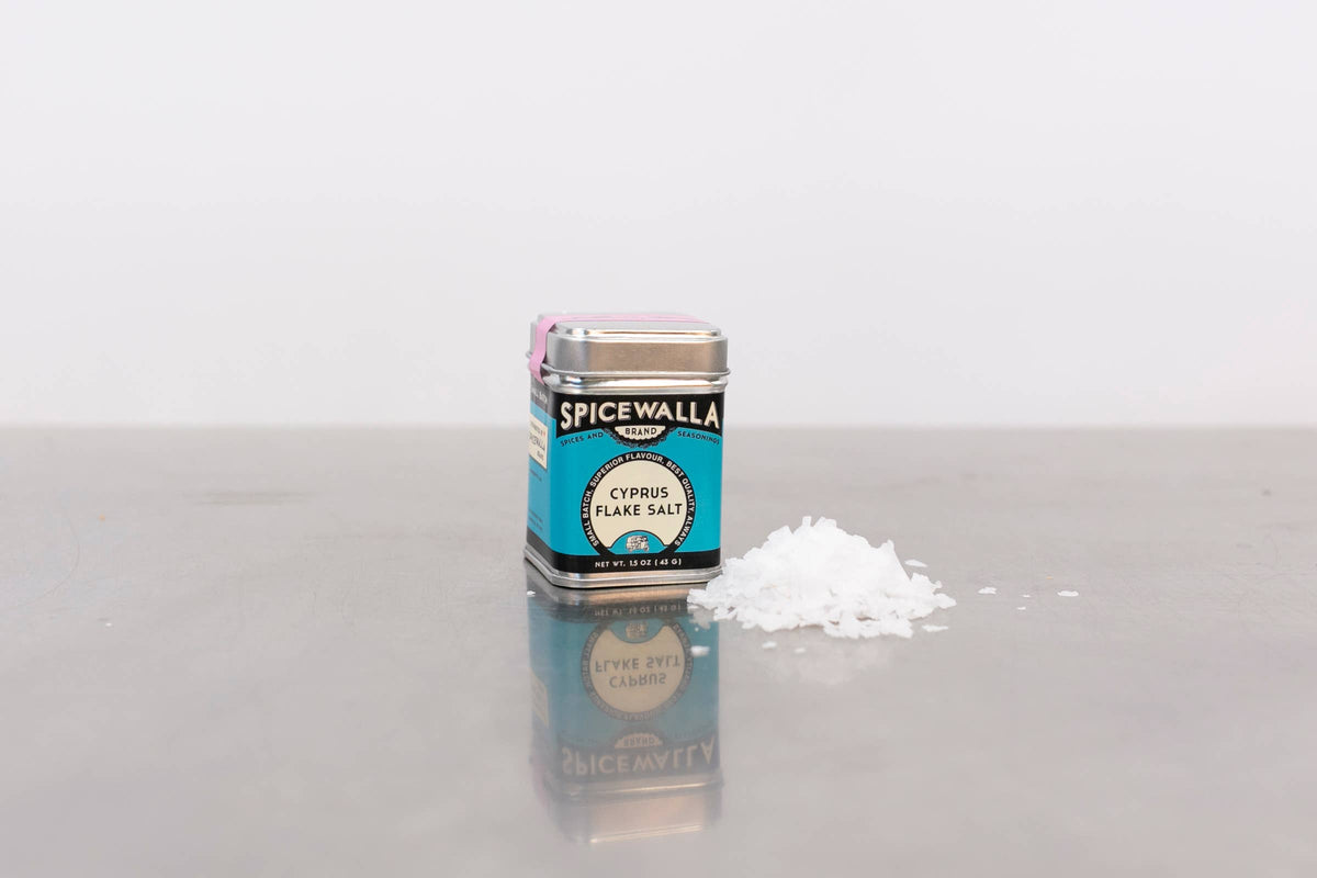 Spicewalla cypress flake salt container on a white surface