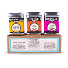 Load image into Gallery viewer, Three Spicewalla BBQ rub containers on a cardboard box with product details.
