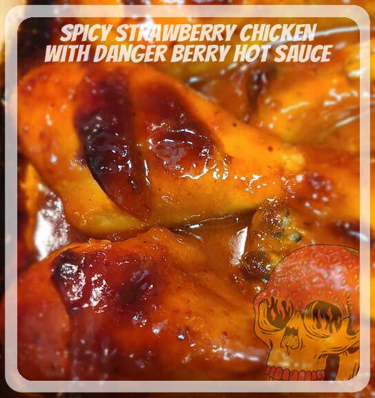 Spicy strawberry chicken with danger berry hot sauce on a white background