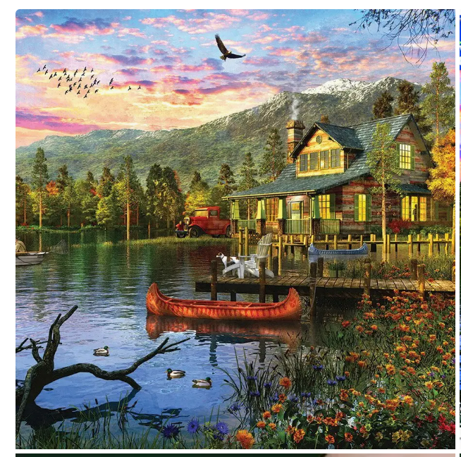 Cozy cabin by a lake with mountains in the background during sunset.