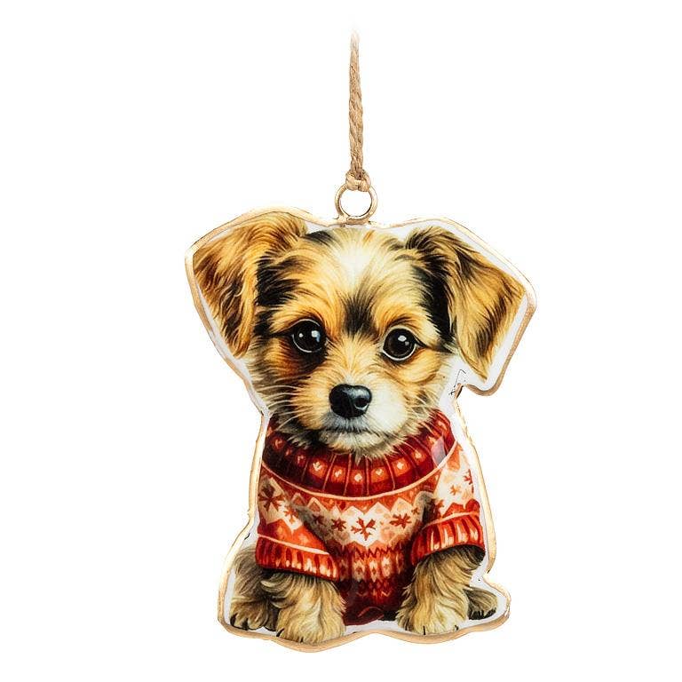 Dog-shaped ornament wearing a red sweater with white patterns on a white background