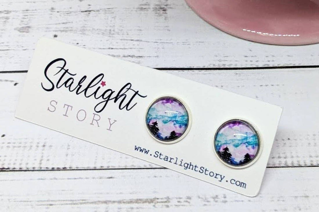 Pair of earrings on a 'Starlight Story' branded card with a white background