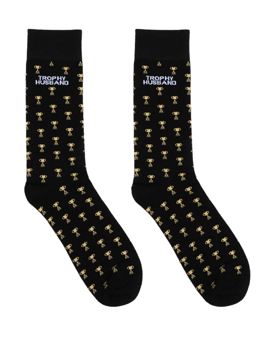 Black crew socks with gold trophies and the words Trophy Husband printed near top