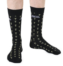 Load image into Gallery viewer, Black socks with white text and trophy patterns on a white background
