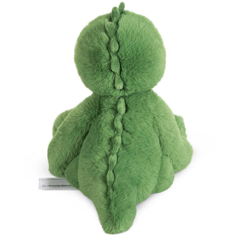 Green plush toy with braided detail on a white background