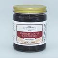 Jar of Whiskey Maple Cranberry Preserves from Olde Haven Farm on a light gray background