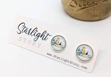 Load image into Gallery viewer, Pair of earrings with a 'Starlight Story' label on a white background
