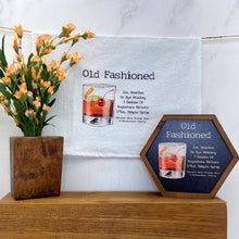 Load image into Gallery viewer, Decorative signs with 'Old Fashioned' cocktail recipe and illustration on a wooden surface with flowers.

