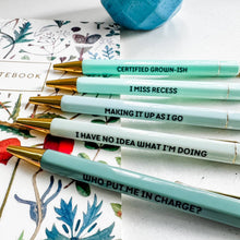 Load image into Gallery viewer, Set of pens with humorous text on a floral notebook background
