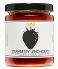 Jar of strawberry lemongrass spread with a black lid on a white background